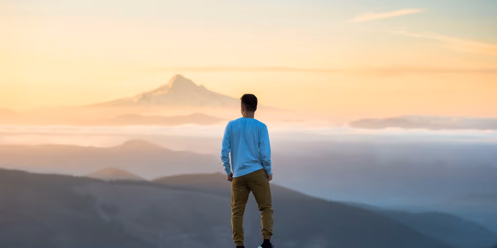 https://unsplash.com/photos/man-standing-on-top-of-mountain-4uojMEdcwI8